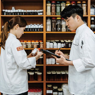 chefs looking at spices